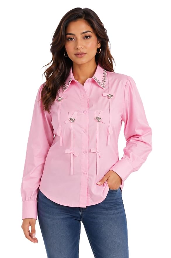 Woman wearing a pink shirt with decorative elements on a white background