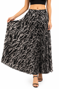 Model wearing a black and grey animal print pleated maxi skirt with elasticated waistband