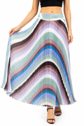 Model wearing a multicolor wave pleated maxi skirt in lavender, sage green, mauve, brown and blue tones