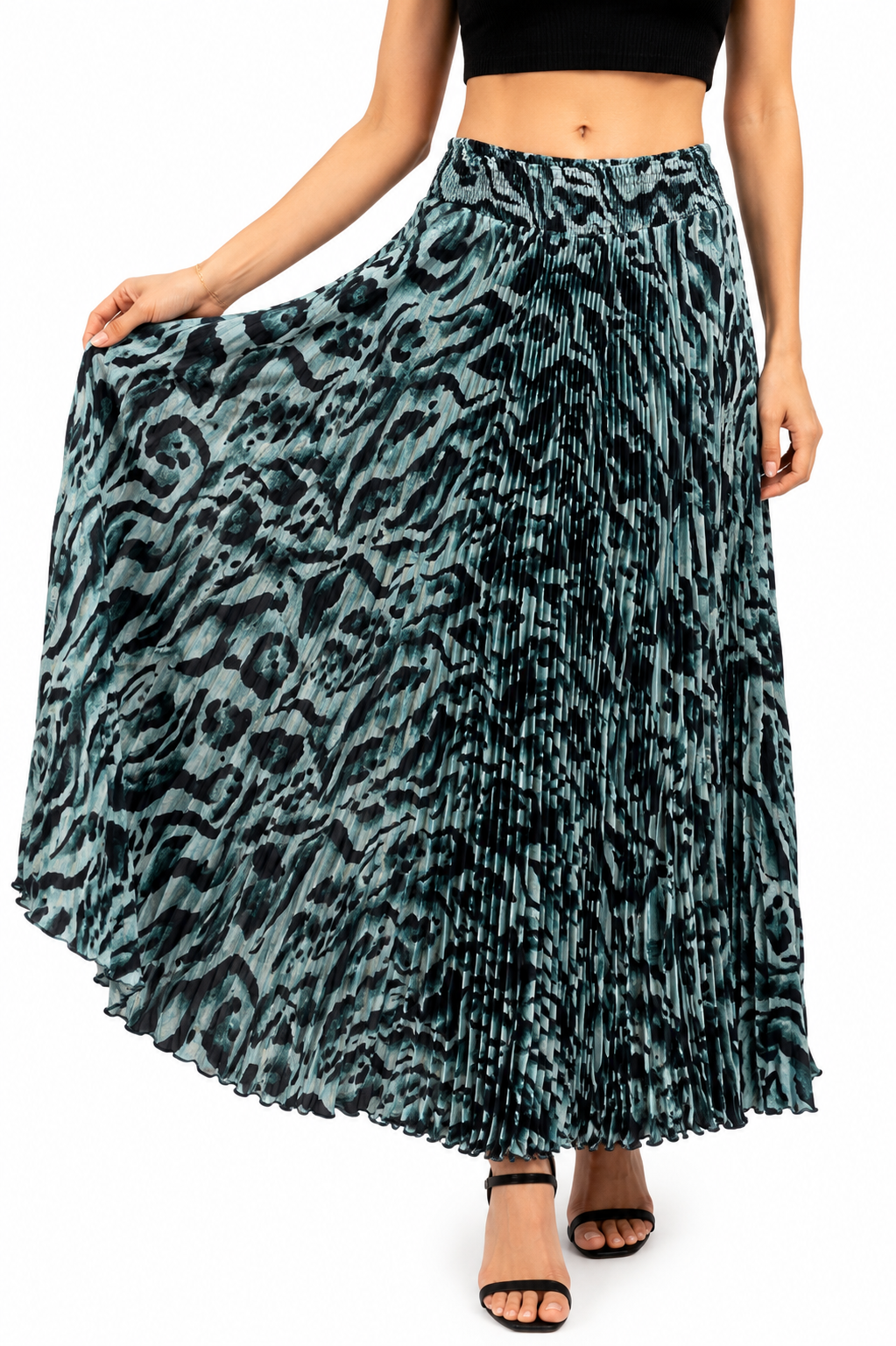 Model wearing a white pleated maxi skirt with blue and teal floral print and elasticated waistband