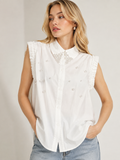 White pearl embellished ruffle sleeveless shirt front view