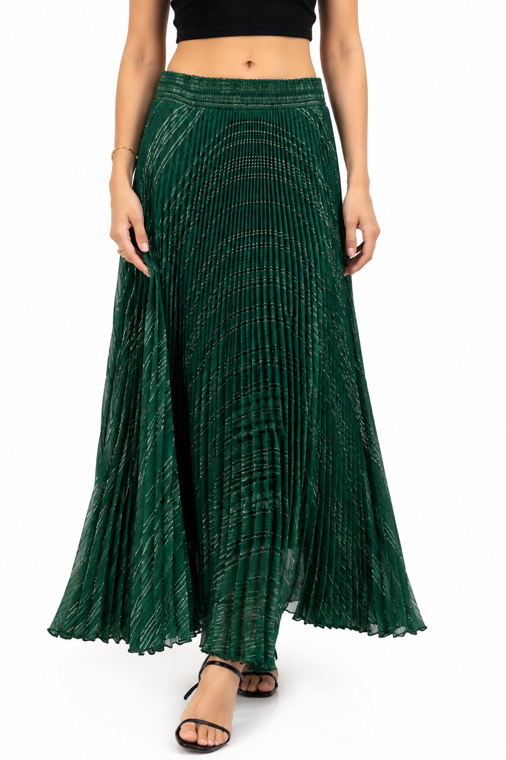 Model wearing an emerald green shimmer pleated maxi skirt with gold metallic threads and elasticated waistband
